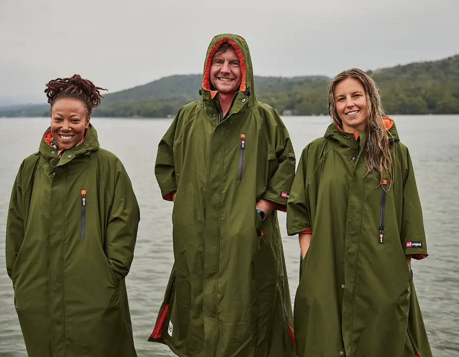 3 people wearing the pro change robe smiling at the camera