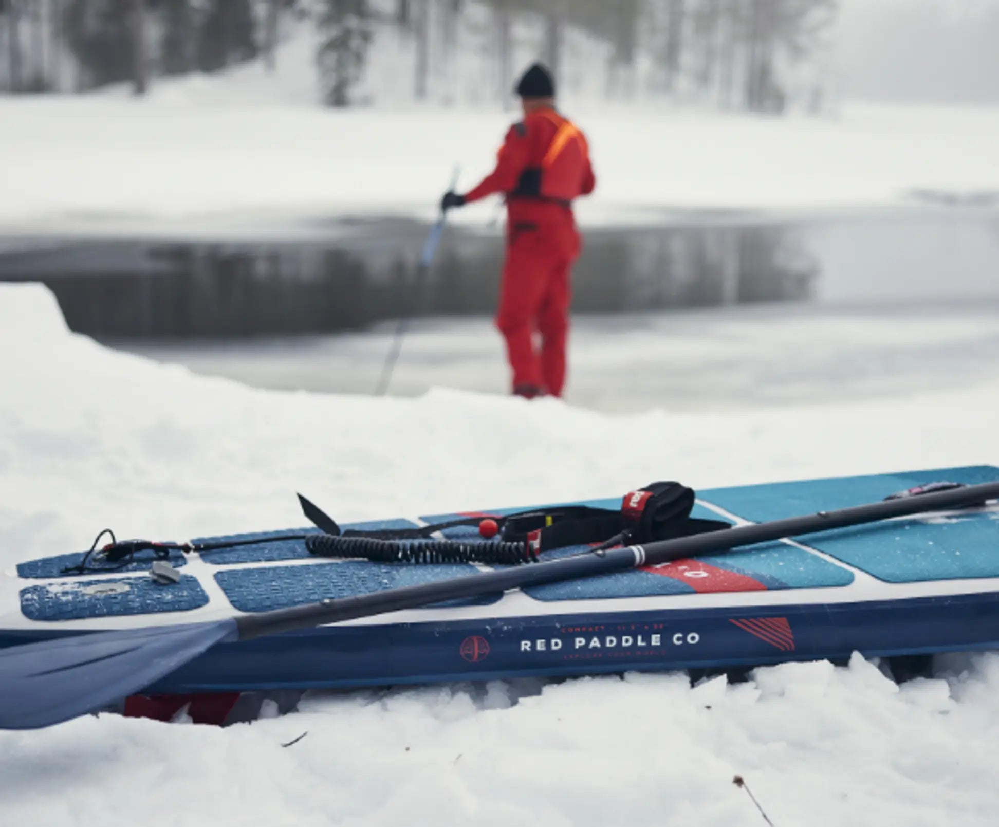 close up of red paddleboard on snow