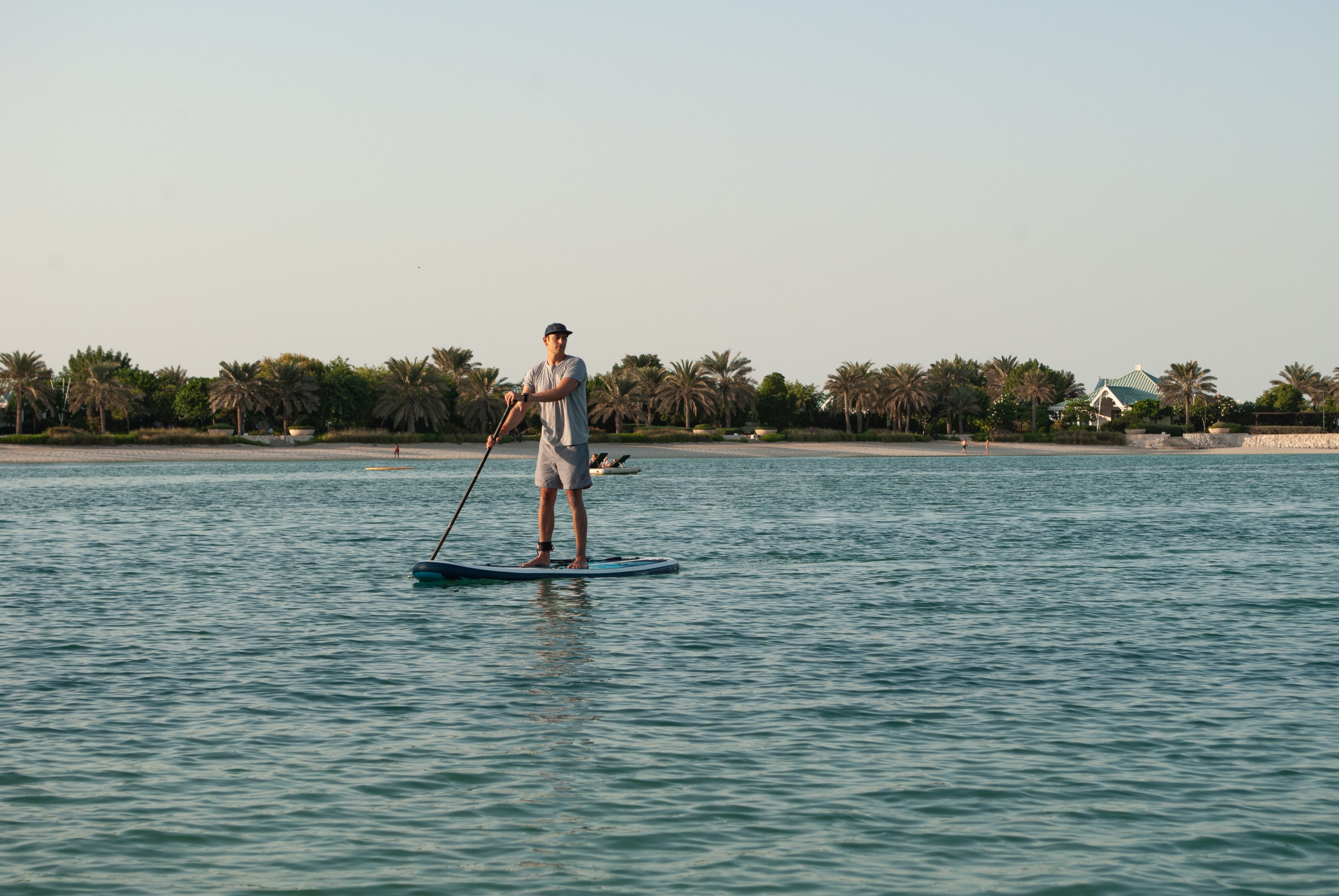 man on his paddleboard paddling on the ocean