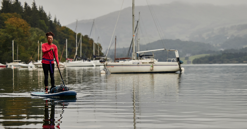 Woman paddle boarding in lake