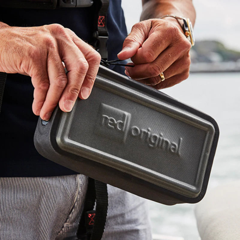 Man holding Red Original waterproof pouch 