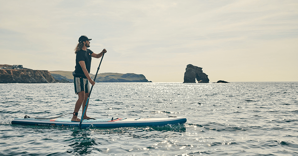 Man paddle boarding in the sea