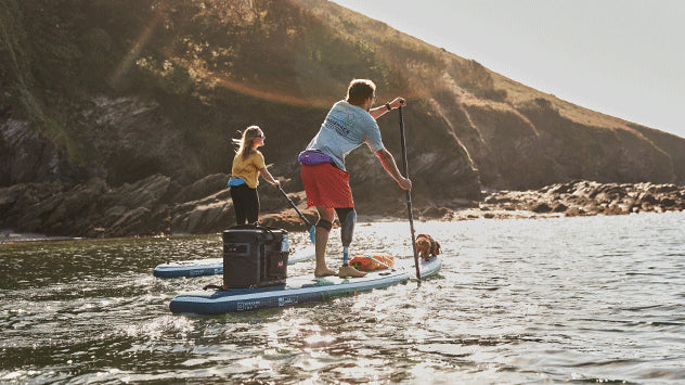 Man and Woman Paddle Boarding in the sea